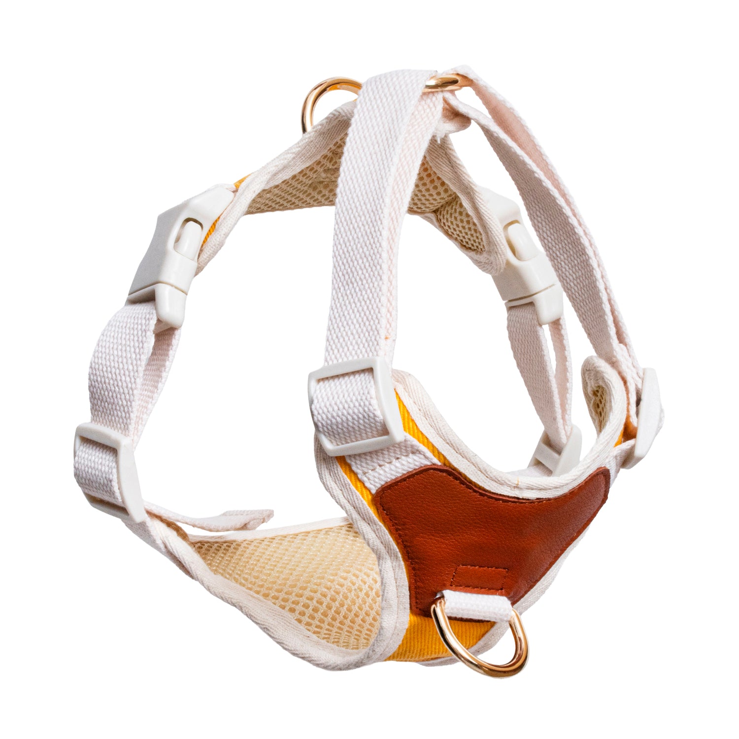 Dog harness with white straps and brown leather accents on a white background